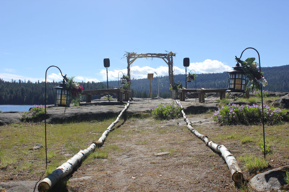 Arch, benches and aisle created with natural materials for wedding ceremony at the Point. 