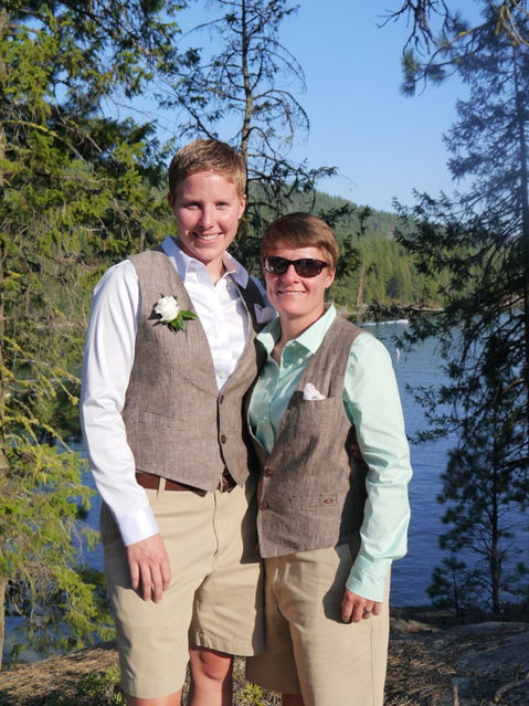 Happy wedding couple in matching vests at Paradise Point.